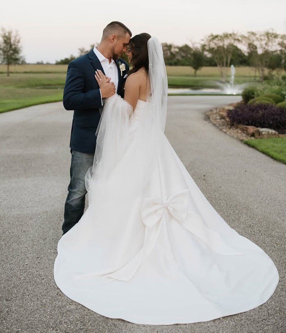 Couple wearing a white gown and a black suit